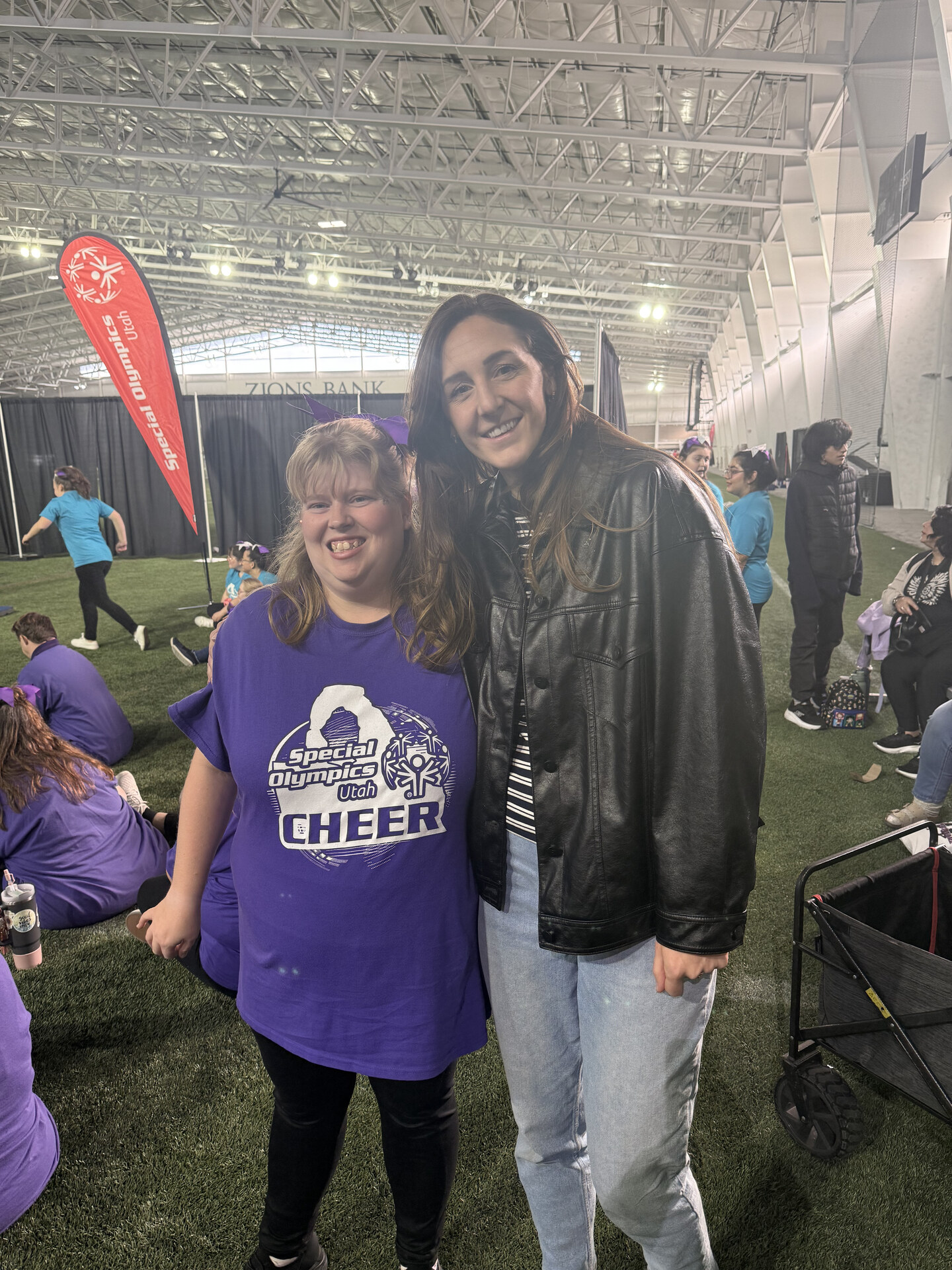 A Liberty Living client at the Special Olympics Utah cheer event with her caregiver
